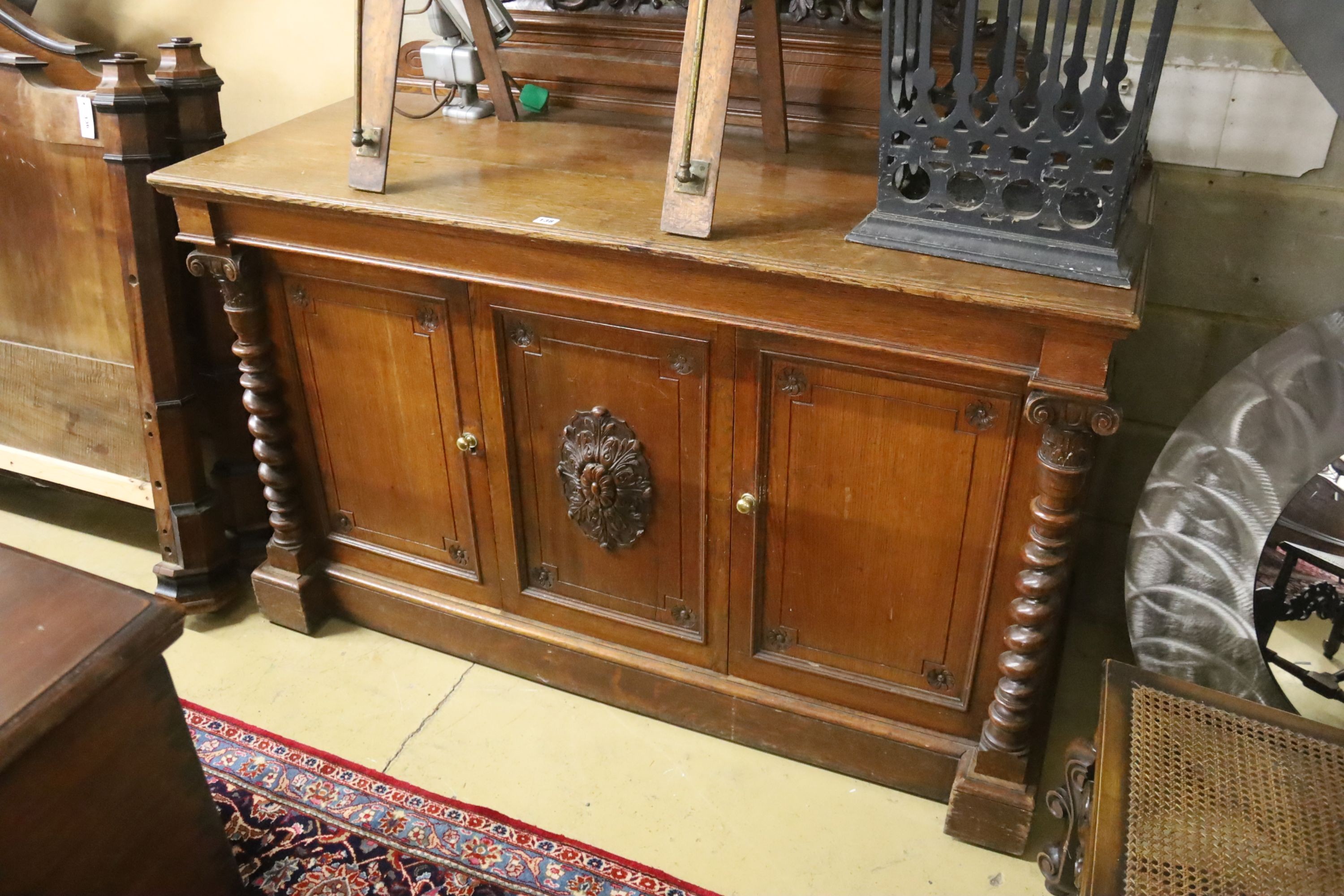 A Victorian oak side cabinet, length 150cm, depth 62cm, height 130cm